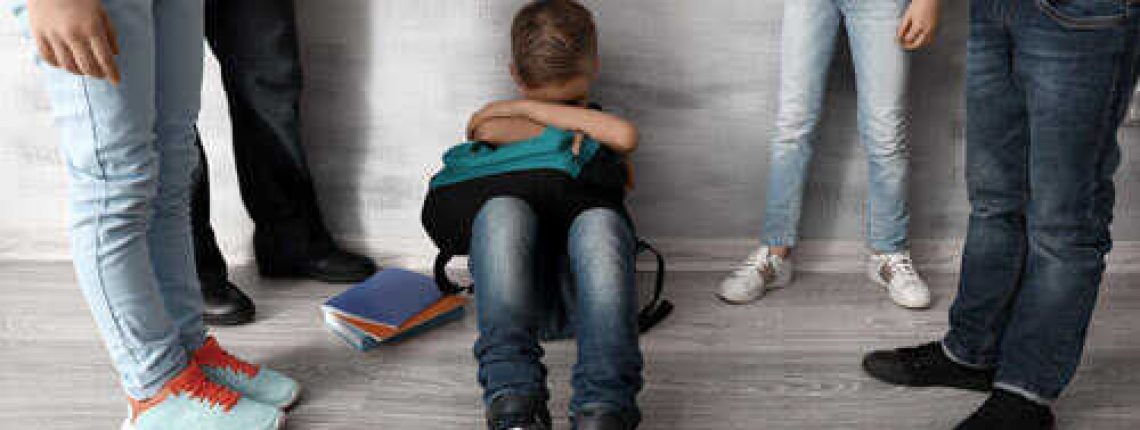 Children-bullying-little-boy-with-backpack-indoors-sm