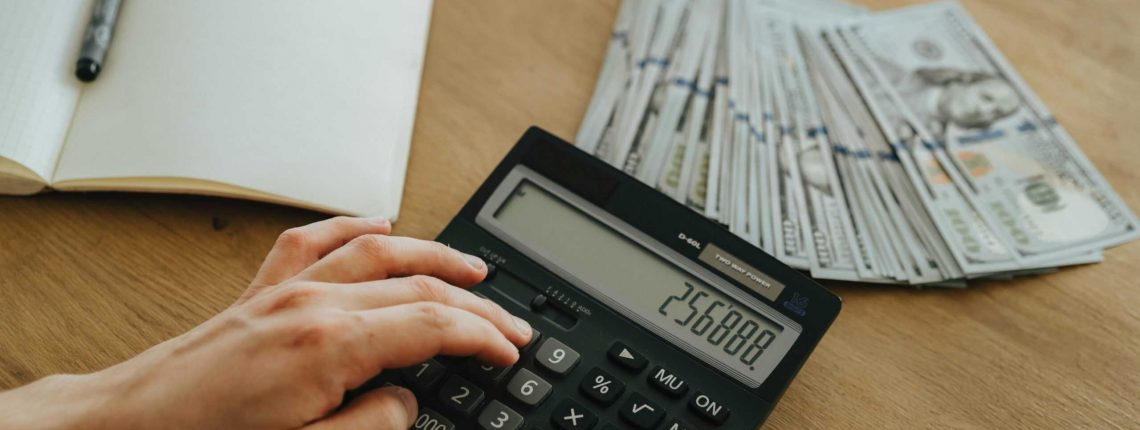Person holding calculator
